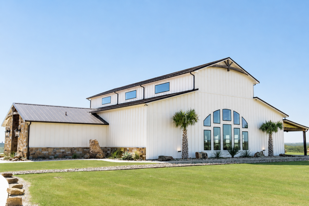 Exterior view of Diamond A Ranch showcasing the rustic venue, open landscape, and scenic Texas countryside surroundings.